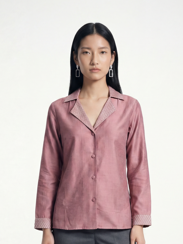 Female model wearing VUNN Rose Silk Jacket — dusty rose silk shirt-jacket with notched lapel, button front and geometric block-printed diamond cuff detail