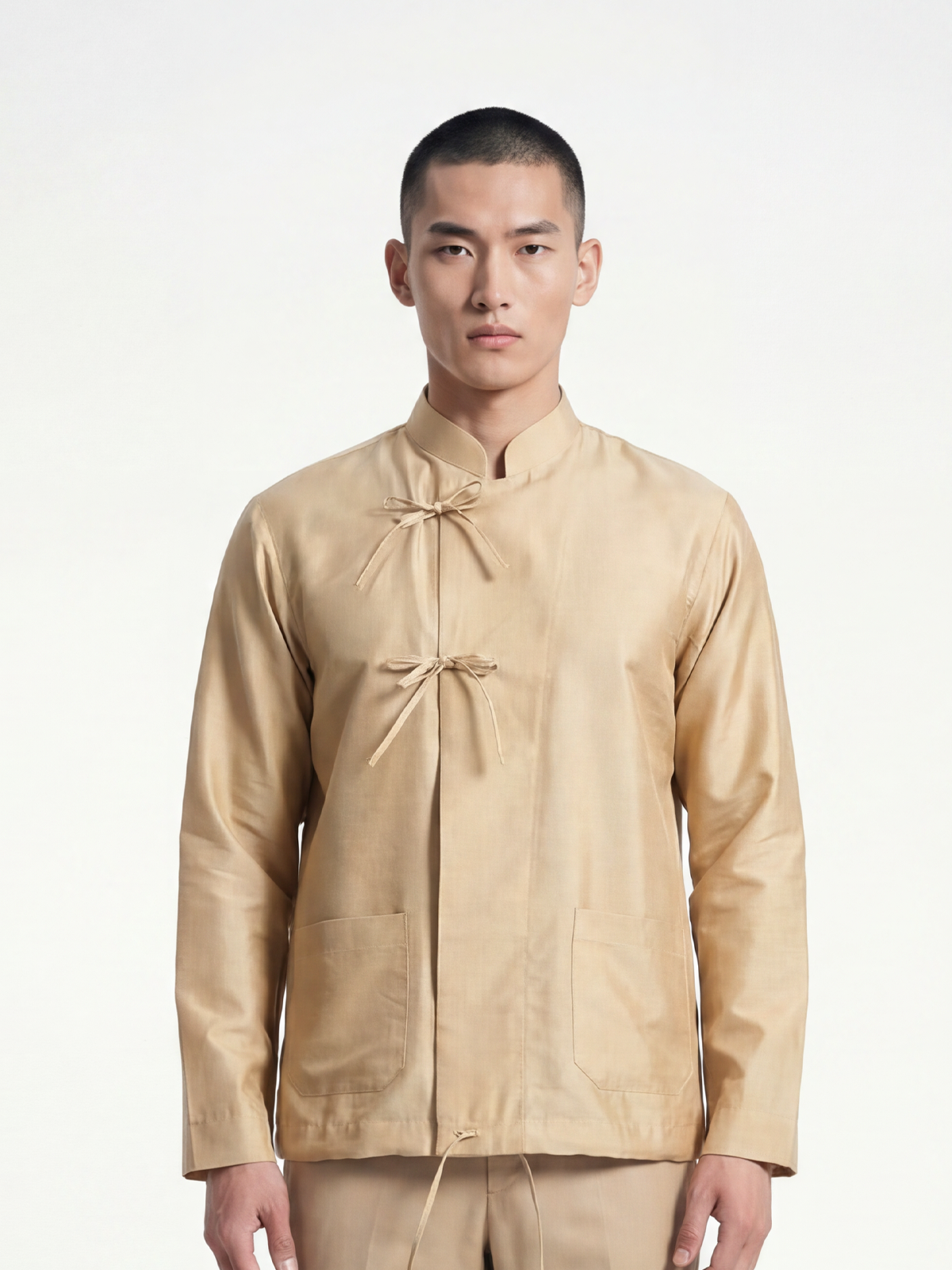 Male model wearing VUNN Champagne Silk Jacket — champagne gold silk jacket with mandarin collar and traditional frog-knot button closures